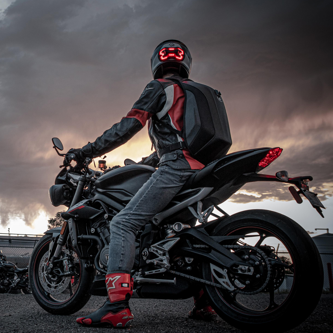 Lifestyle photo of black Brake Free. Ride with confidence and style with Brake Free. Brake Free - an ultra-bright smart LED brake light that instantly improves rider's visibility. Simple installation, no wires. Smart brake light for your helmet. Be seen day and night. Ride in any weather. Long lasting rechargeable lithium ion battery.