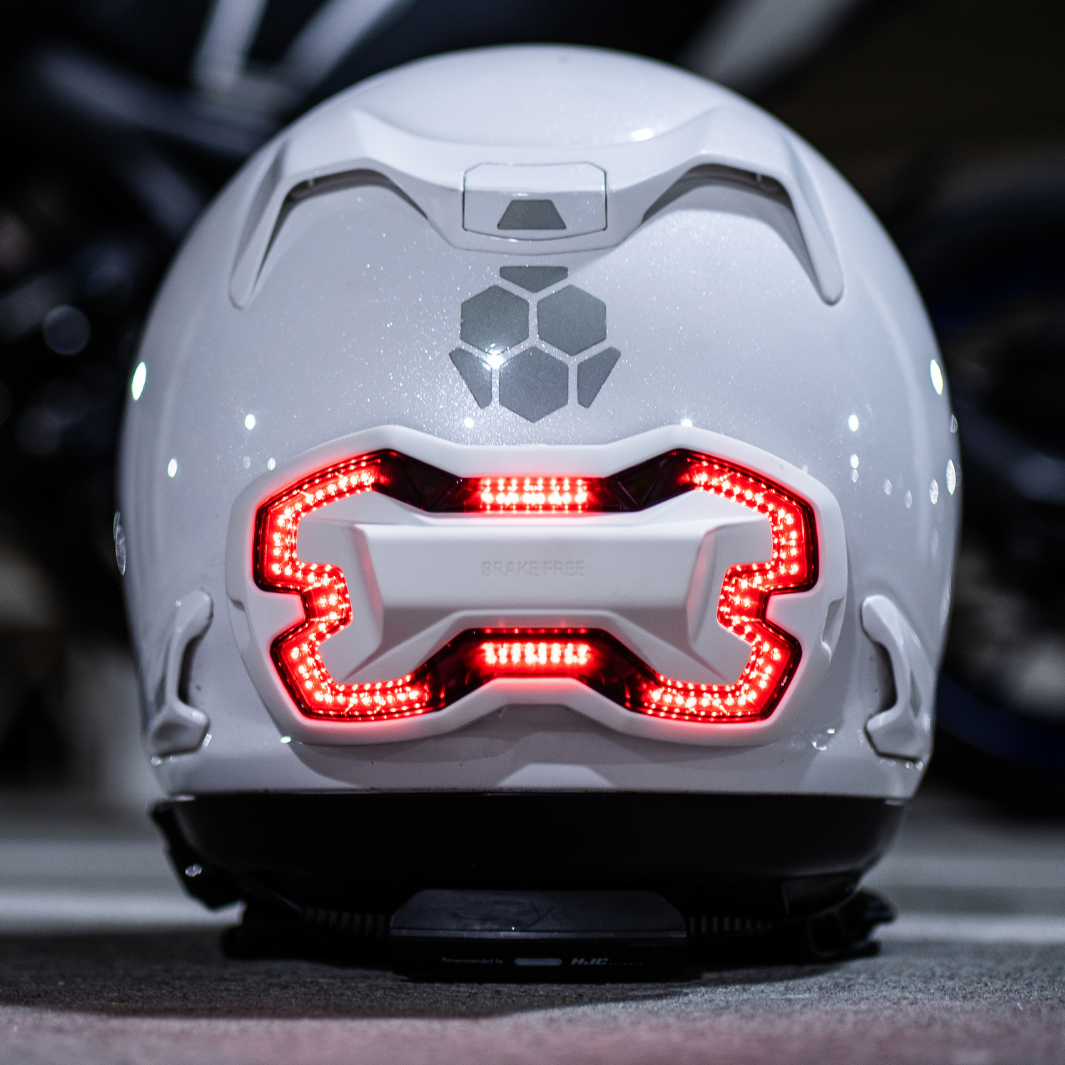 white Brake Free helmet light on white Arai helmet